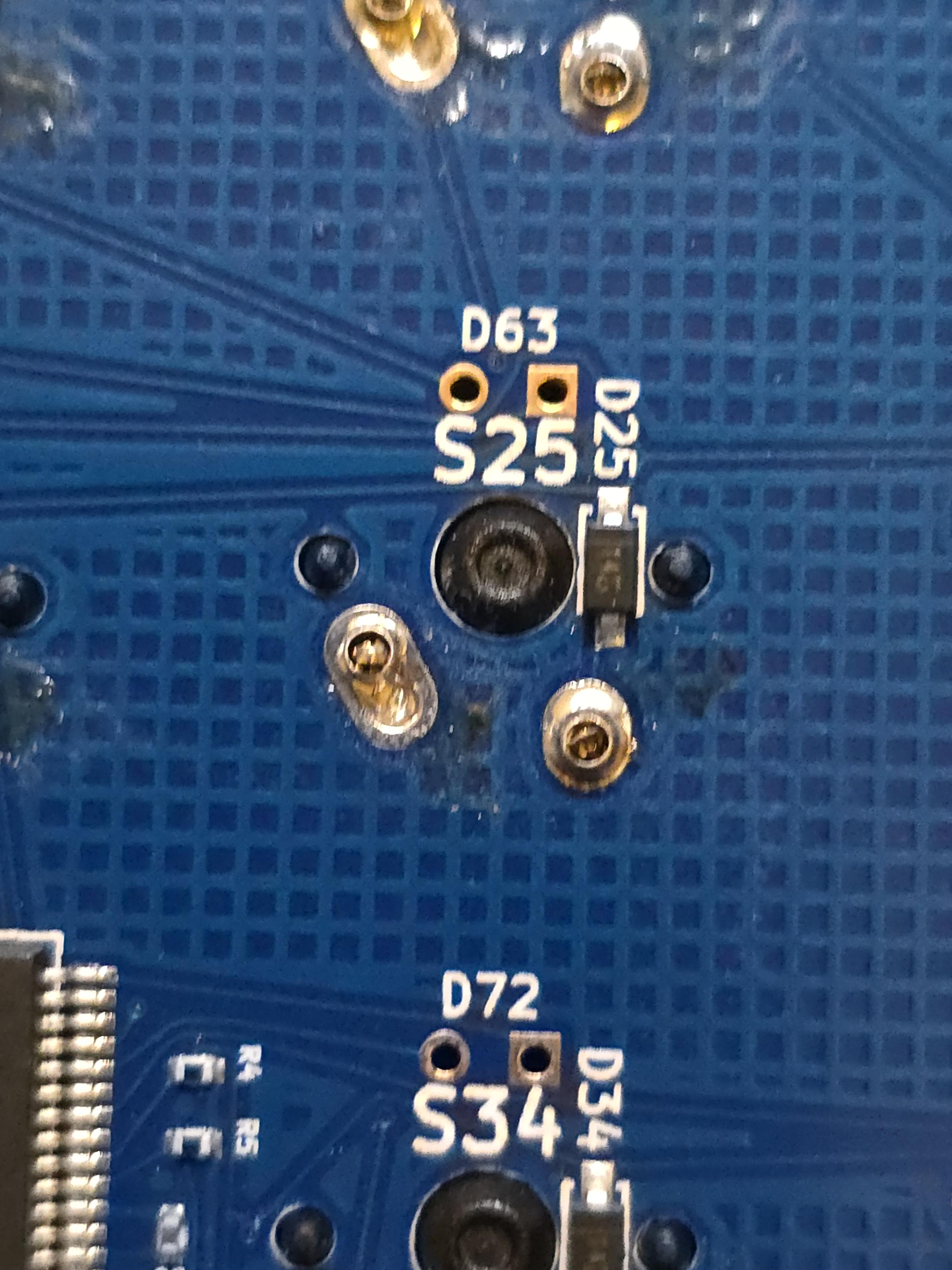 A close up on one of the switch footprints, where the tiny sockets are visible soldered inside a universal keyboard switch PCB footprint